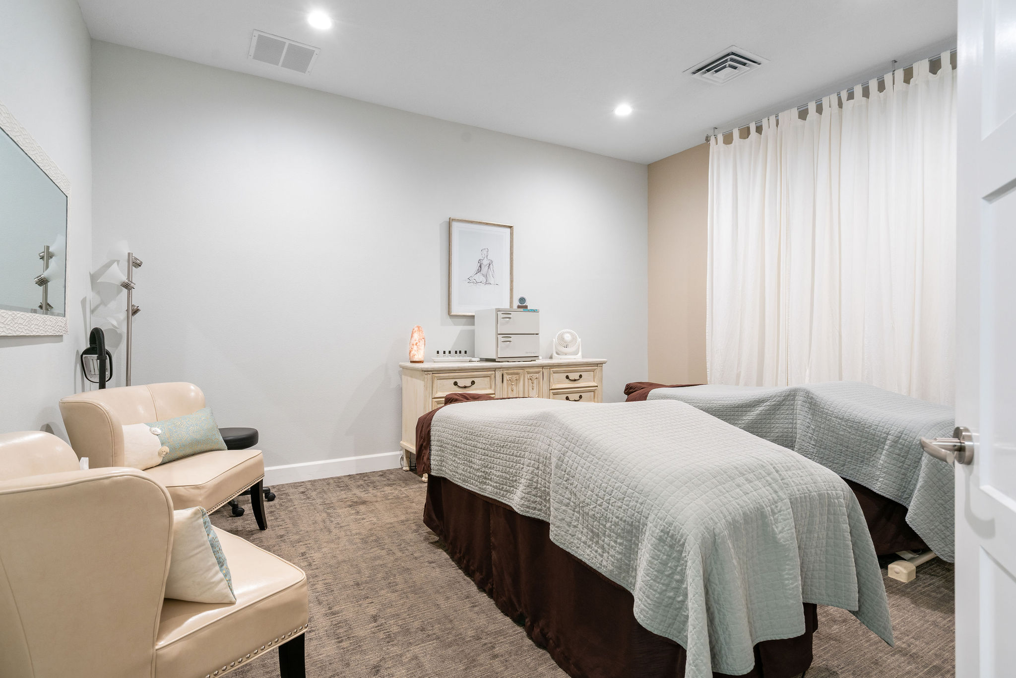 Serene spa room with two massage tables