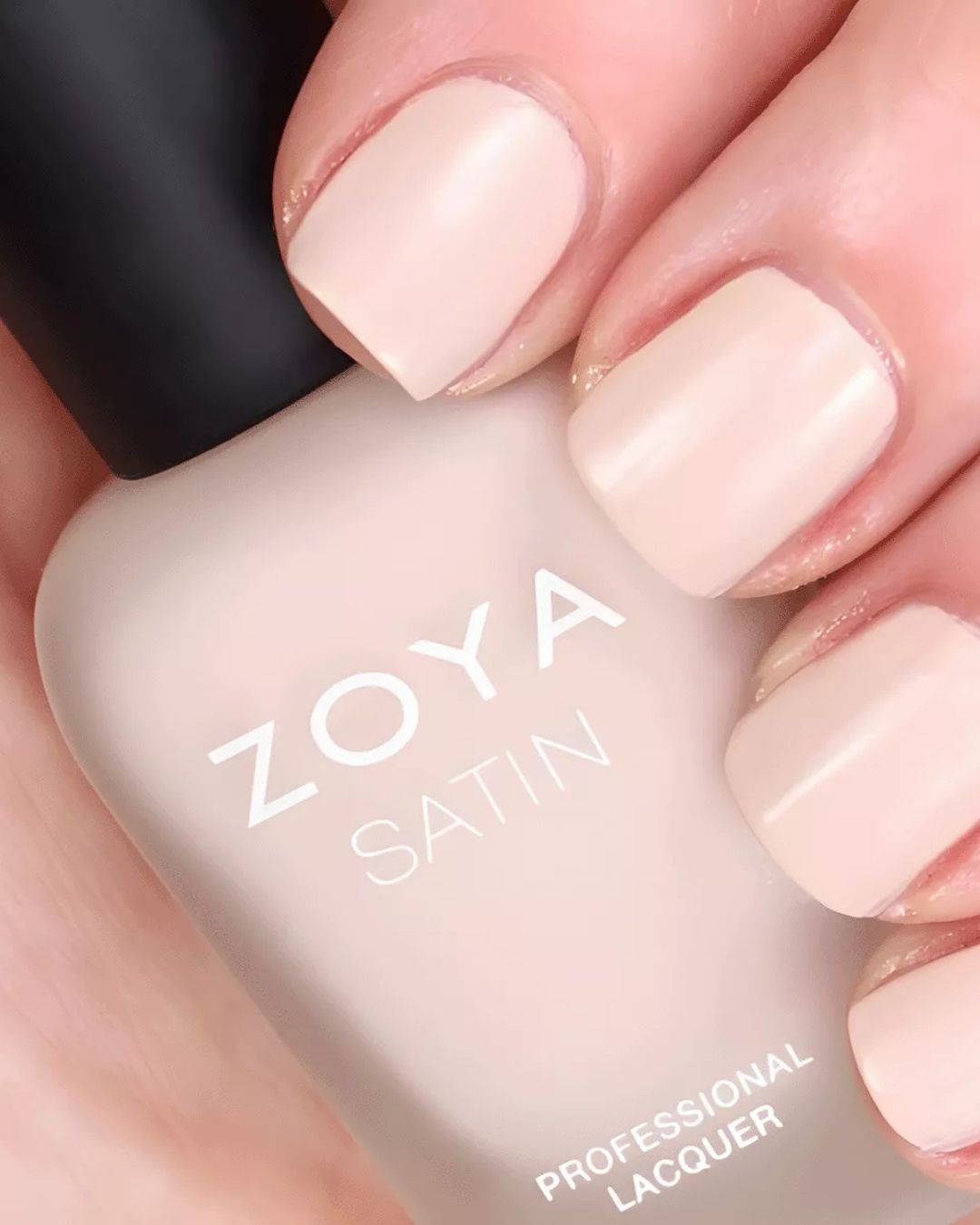 zoya Woman receiving salt scrub back massage at spa